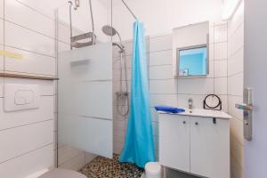 a bathroom with a shower and a toilet and a sink at 11 - Le Rossignol - Village vacances in Maché