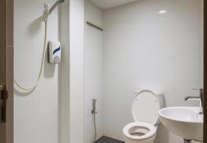 a bathroom with a shower and a toilet and a sink at Cahaya Midah Hotel (BilikXpert) in Kuala Lumpur