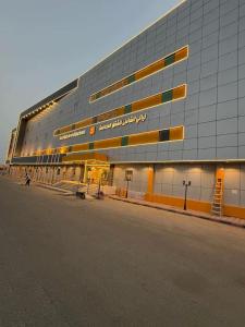 a large building with a sign on the side of it at شقق ليالي الشاطئ in Al Qunfudhah