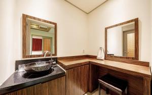 a bathroom with a sink and a mirror at Jardin Hotel in Seoul +35 photos