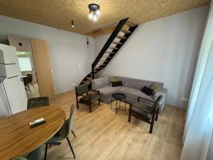 a living room with a couch and a table at Apartament Zbąszynek in Zbąszynek