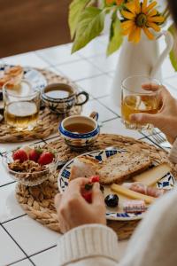 a table topped with plates of food and drinks at Les Ecuries du bout du monde in Landunvez +28 photos