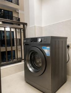 a washing machine in a room with a building at 3 bedroom ensuite apartment Lavington in Nairobi
