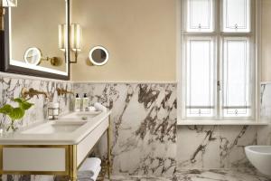 a bathroom with a sink and a mirror at Relais Sant'Uffizio in Cioccaro