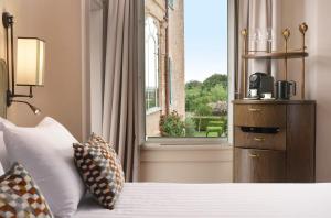 a bedroom with a bed and a large window at Relais Sant'Uffizio in Cioccaro