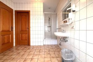 a bathroom with a sink and a toilet in it at Hotel und Restaurant Römerstein in Bad Aussee +31 photos
