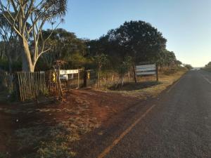 a fence on the side of a road at Ethlathini Rest Camp in Hluhluwe