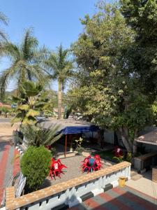 an overhead view of a park with tables and chairs at New Gold city hotel in Mwanza