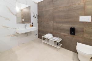 a bathroom with a sink and a toilet at Vie Del Salento in San Pancrazio Salentino +42 photos