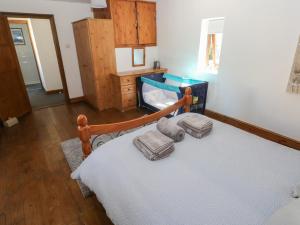 a bedroom with a bed with a fish tank on it at Tor Cefn in Kidwelly