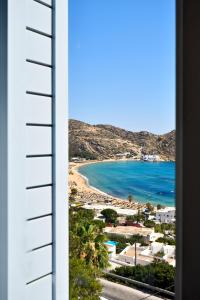 a view of a beach from a building at Theros Apartments 3 in Mylopotas +3 photos