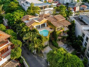 an aerial view of a house in a city at Teetara Villa Patong in Patong Beach