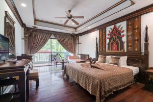 a bedroom with a bed and a piano at Le Palace hotel krabi in Ban Khlong Haeng