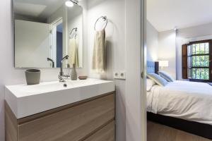 A bed or beds in a room at Plaza de Refinadores