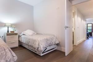 A bed or beds in a room at Plaza de Refinadores