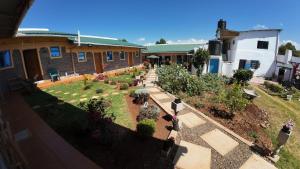 an overhead view of a garden in front of a house at jc iten in Iten