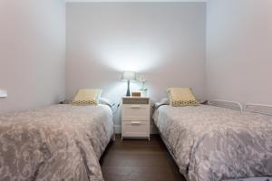 A bed or beds in a room at Plaza de Refinadores