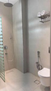 a bathroom with a shower and a toilet at Tim in Riyadh
