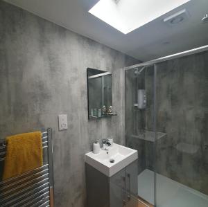 a bathroom with a sink and a shower at The Nook in Inverness