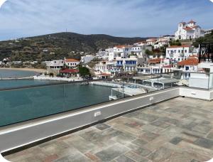 a view of a town from the balcony of a house at Luxury Maisonet Veranda View Batsi in Batsi