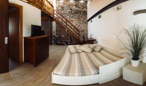 a bedroom with a large bed in a room at PICCOLA VILLA nel Centro Storico in Arona