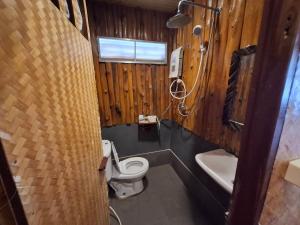 a small bathroom with a toilet and a sink at Phupai Lake Resort in Ban Wang Khun Knachen +63 photos