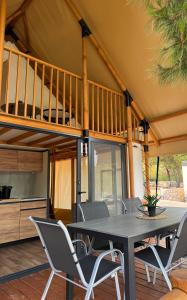 a dining room with a table and chairs at Luna Glamping de Luxe in Drage +62 photos