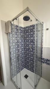 a shower with a glass door in a bathroom at La casa del Capitano, l'uomo e il mare ... in Lipari +40 photos