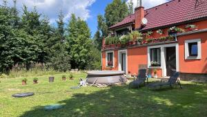 a house with a fire pit in the yard at Apartmán Bystré in Bystré
