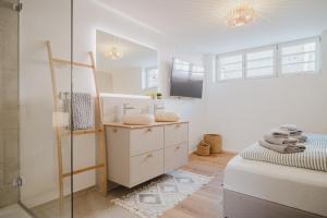 a white bathroom with a glass shower and a bed at Boho - Suites I BRIGHT-Collection in Koblenz +131 photos