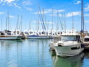 a group of boats docked in a harbor at L'ESCAPADE MARINE - face à la Mer in Port-de-Bouc +6 photos