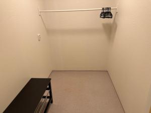 an empty closet with a black table in a room at Villa Fresvik in Fresvik