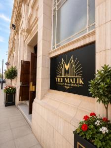 a sign on the side of a building at The Malik - An Art Deco Hotel in Birmingham