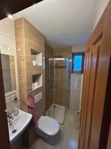a bathroom with a shower and a toilet and a sink at Chata Biely Potok in Oravský Biely Potok +10 photos