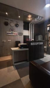 a reception area of a restaurant with a reception desk at Hotel Bhiwandi Palace Nashik Highway Rd in Bhiwandi