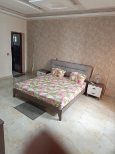 a bedroom with a bed in a room at Bbimo in Dakar