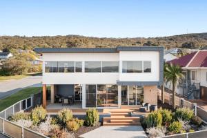 a modern house with a lot of windows at The Lookout, Albany Holiday House in Albany