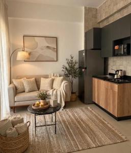 a living room with a couch and a table at StepInn in El Alamein