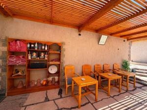 a dining room with chairs and a table and shelves at Bonanza beach camp in Nuweiba +10 photos