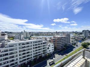 a view of a city from a building at Kameari 1111 - 11F Newly Renovated High Floor City View 2min to Mall 5min to Station Disney Access in Tokyo