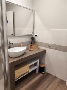 a bathroom with a sink and a mirror at B&B Il Dolce Castello di Balestrino in Balestrino +33 photos