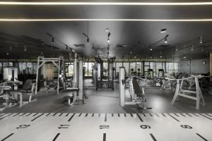 a gym with several treadmills and machines at Pyramisa Suites Hotel Cairo in Cairo