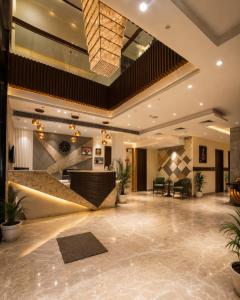 a lobby of a hotel with a reception desk at Comfort Sure in Amritsar