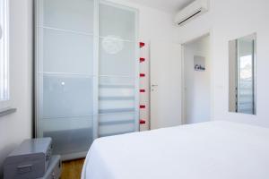 Ένα ή περισσότερα κρεβάτια σε δωμάτιο στο Nila Apartment