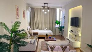 a living room with a couch and a bed at RAFiF Pyramids View Hotel in Cairo