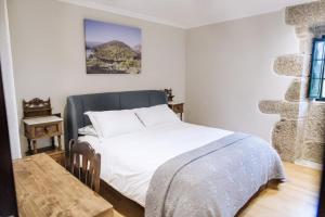 Tempat tidur dalam kamar di Casa Quinteliña