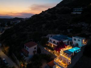 an aerial view of a house with lights at ILIOS COVE by A&D Properties in Porto Rafti