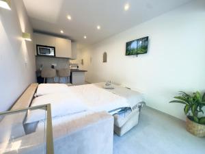 a bedroom with a large bed in a room at Sublime apartment - Beachfront in Saint-Laurent-du-Var