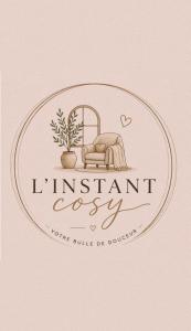 a logo for a furniture store with a bed in a round frame at L'instant Cosy in Gamaches