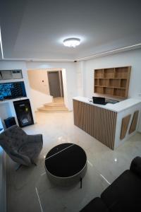 a living room with a couch and a table at Vivora Residence in Radovici